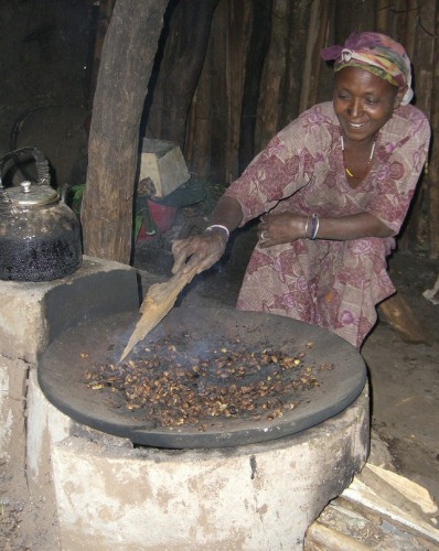 An Ethiopian woman roasts coffee with her new cooking stove. Photo courtesy Daniela Tunger