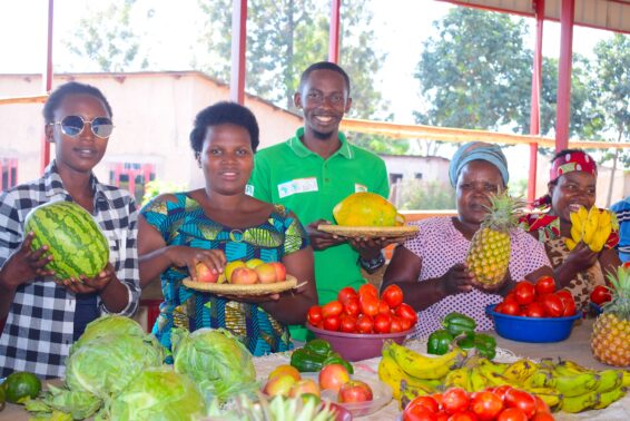 Farmers working on fields in eastern Rwanda where climate-smart farming practices are being applied.