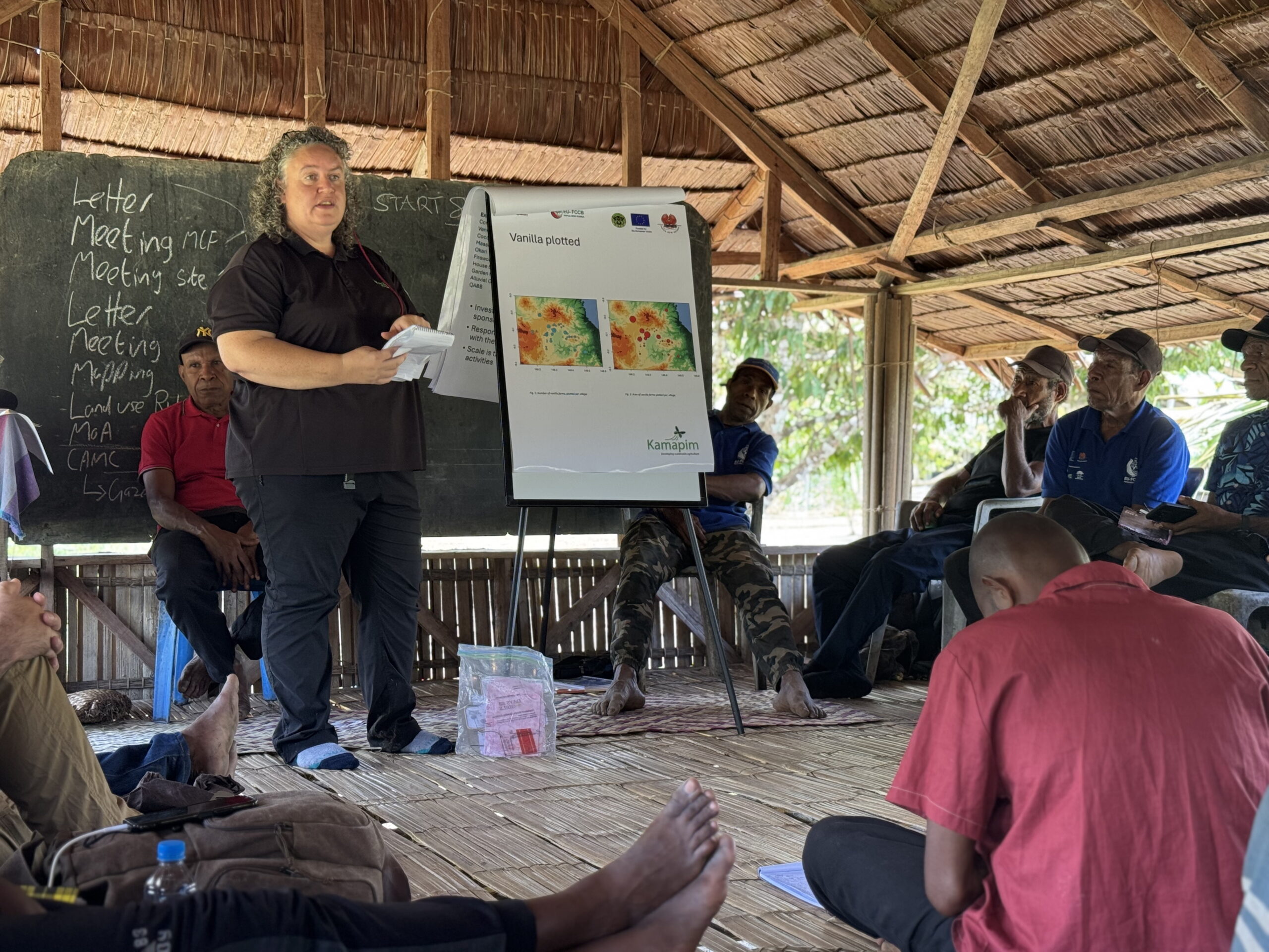 Nancy Irwin of Kamapim Ltd addressing community members during a meeting on vanilla production and quality standards in Managalas, Papua New Guinea.
