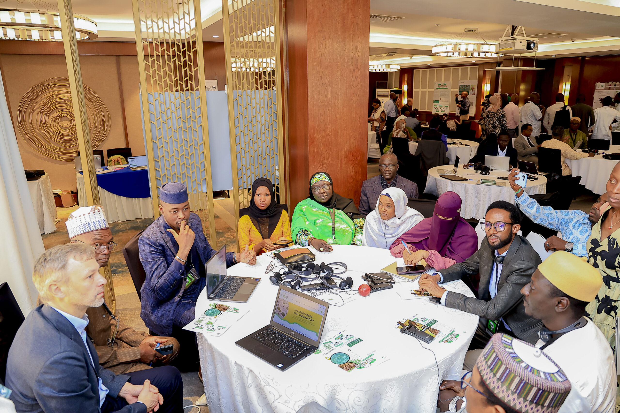 Participants sit around a table during a Great Green Wall working session.