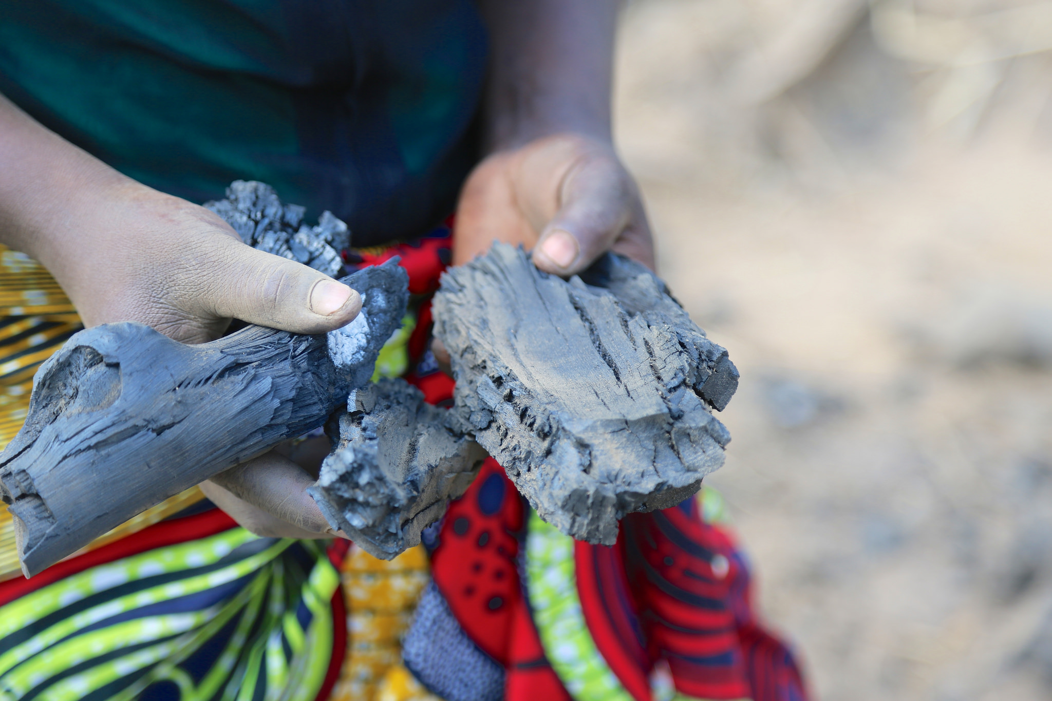 Women producing charcoal in Zambia