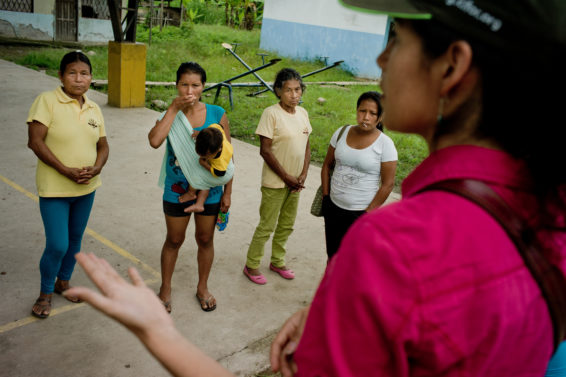 Center for International Forestry Research (CIFOR) scientist Elena Mejia talks to some Kichwa women. After CIFOR will meet with the rest of the villagers to inform them of CIFOR's findings, Napo Province, Ecuador.