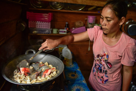 Changing diets in Kapuas Hulu Ibu Rosalina cooking fish with Keluwih.