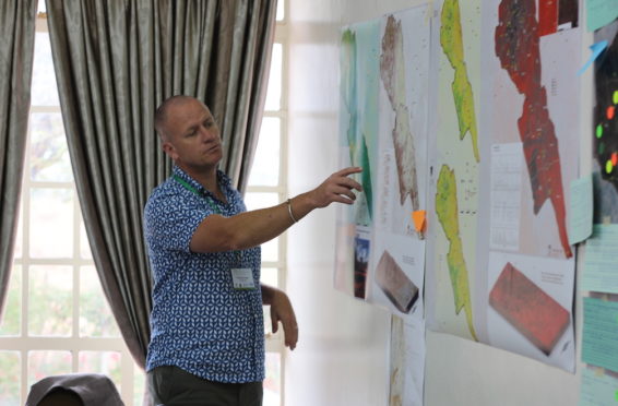 A man points at a map