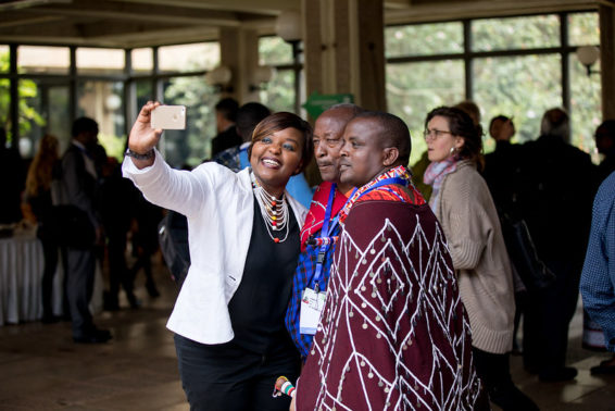 Three people take a selfie