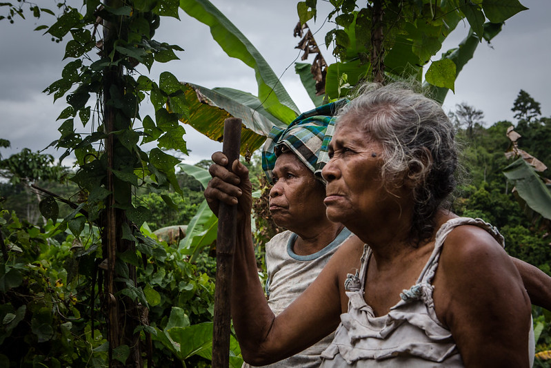 Women stand in their garden