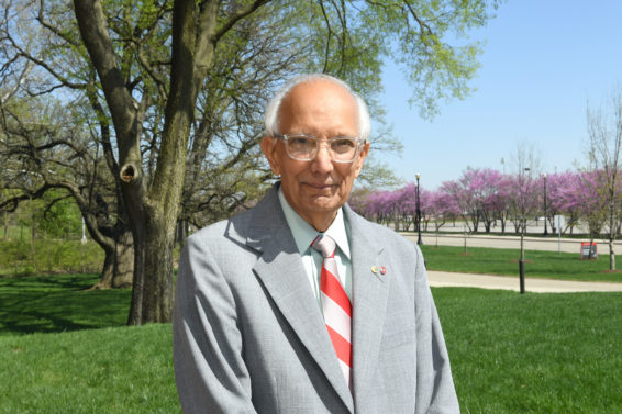 Rattan Lal stands in front of a tree