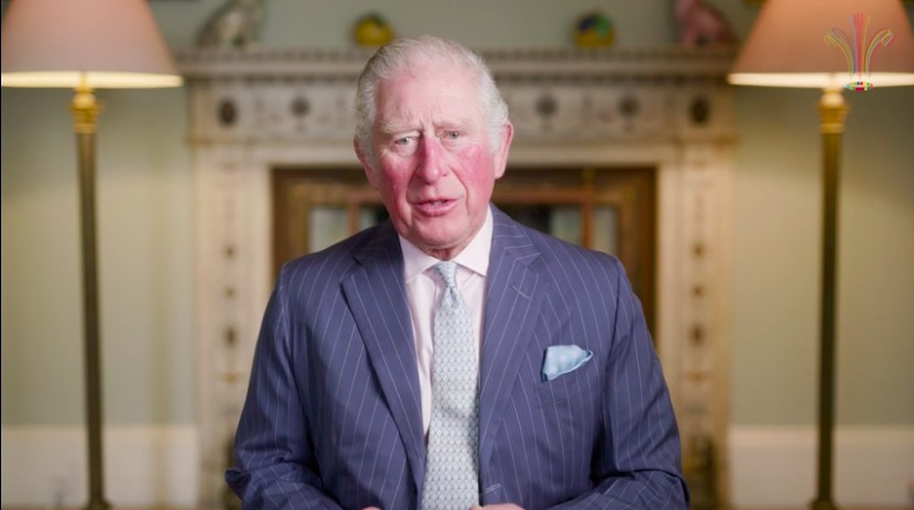 Britain's Prince Charles sits in a drawing room facing the camera