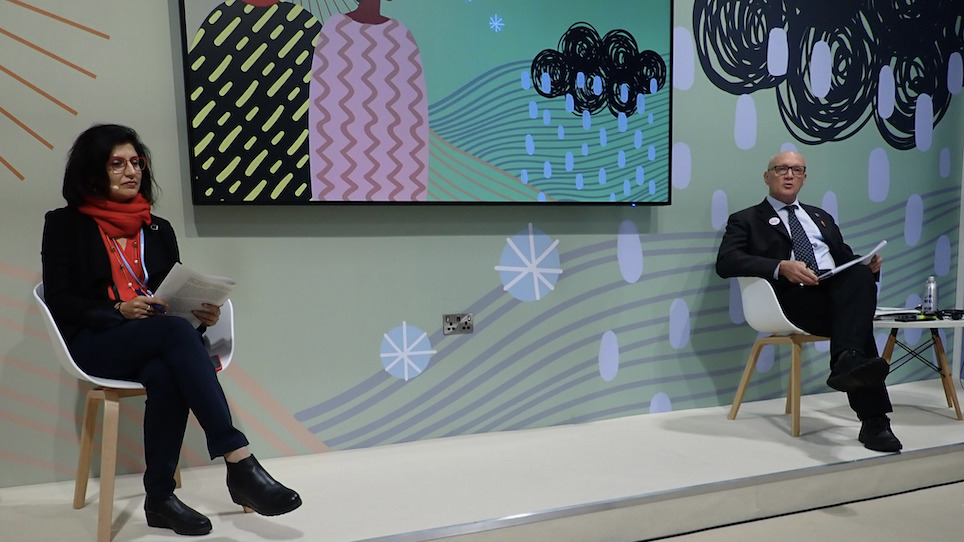 Delegates sit on a panel