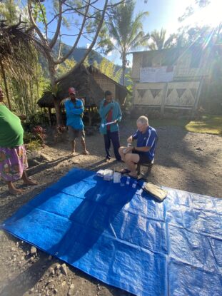 Peter Gamgee preparing medical supplies for a village in Papua New Guinea before the expedition to find the WWII Flying Dutchman wreck in the Owen Stanley Range.