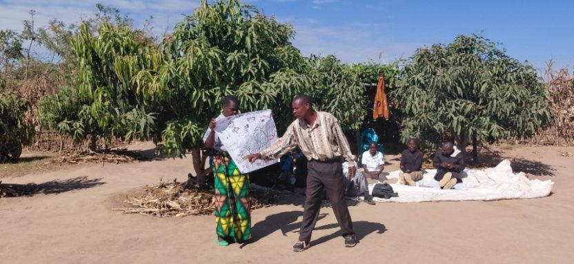 Mr and Mrs Mathambo in Malawi share their vision plan under mango trees, showing women empowerment in Malawi mango value chains and improved household collaboration.
