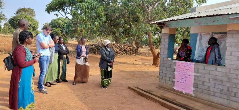 Victor Tembo and his wife in Malawi present their farm vision and food tree value chain plans to a delegation of visitors.
