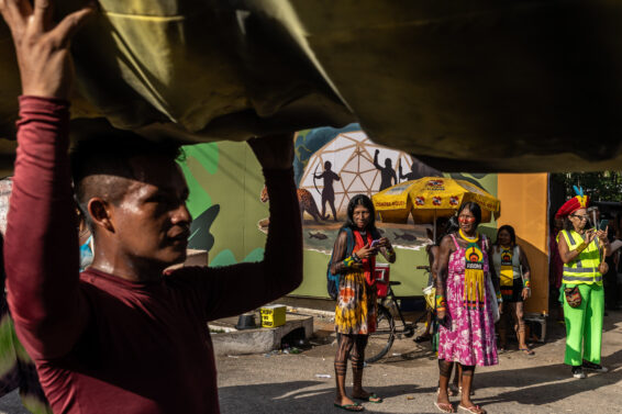 Indigenous protesters gather during a demonstration at COP30 in Belém, Brazil.