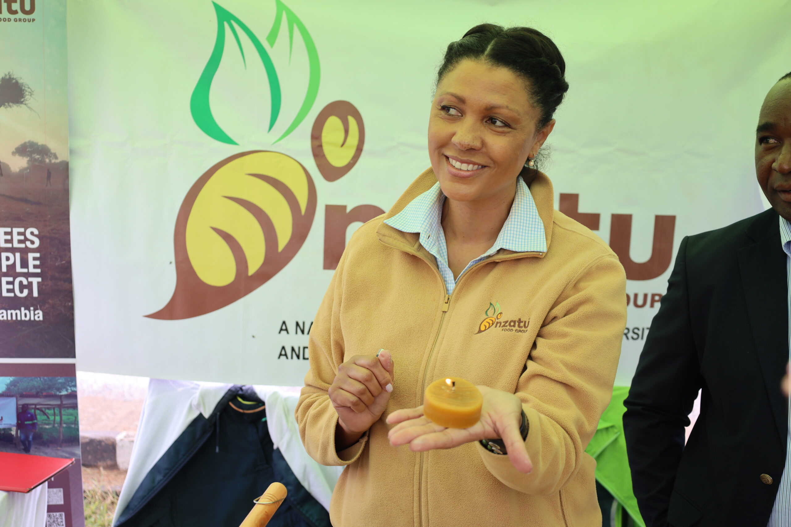 Denise Madiro demonstrates beeswax products at an exhibition stand
