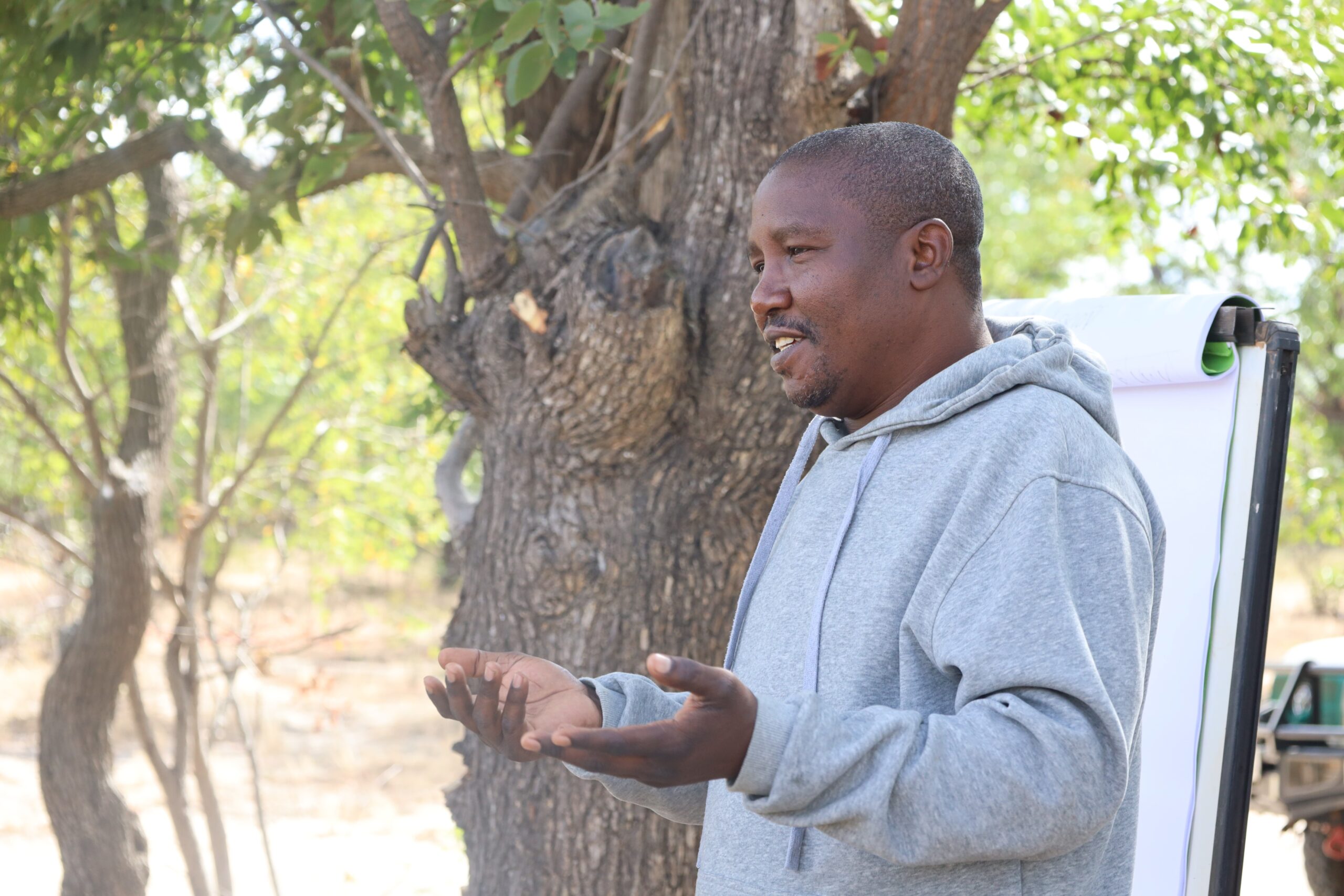 District livestock officer Nyambe Mulemwa speaking during an outdoor livestock health session