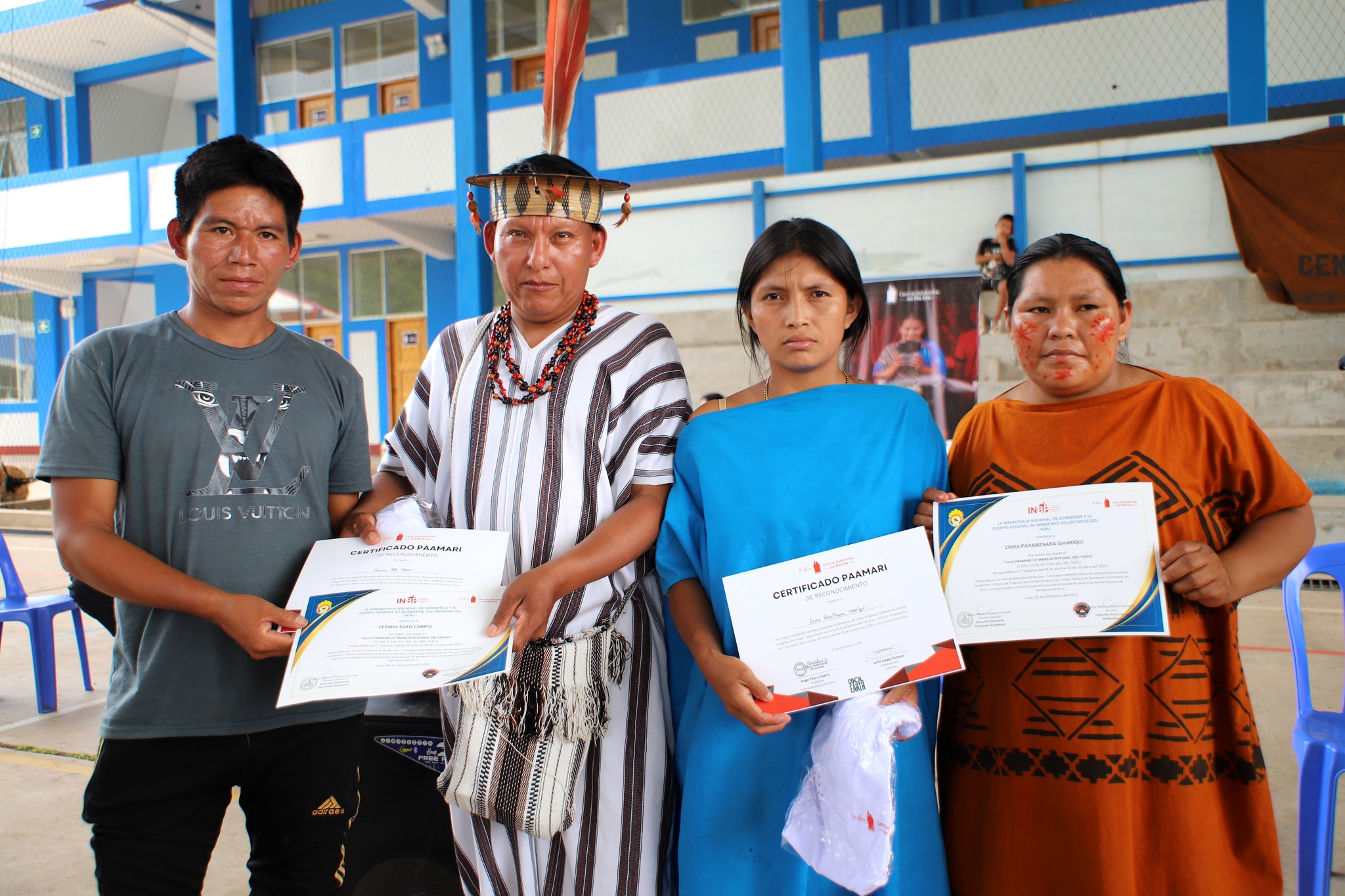 Participants from Asháninka communities display their certificates after completing training through the CARE School.