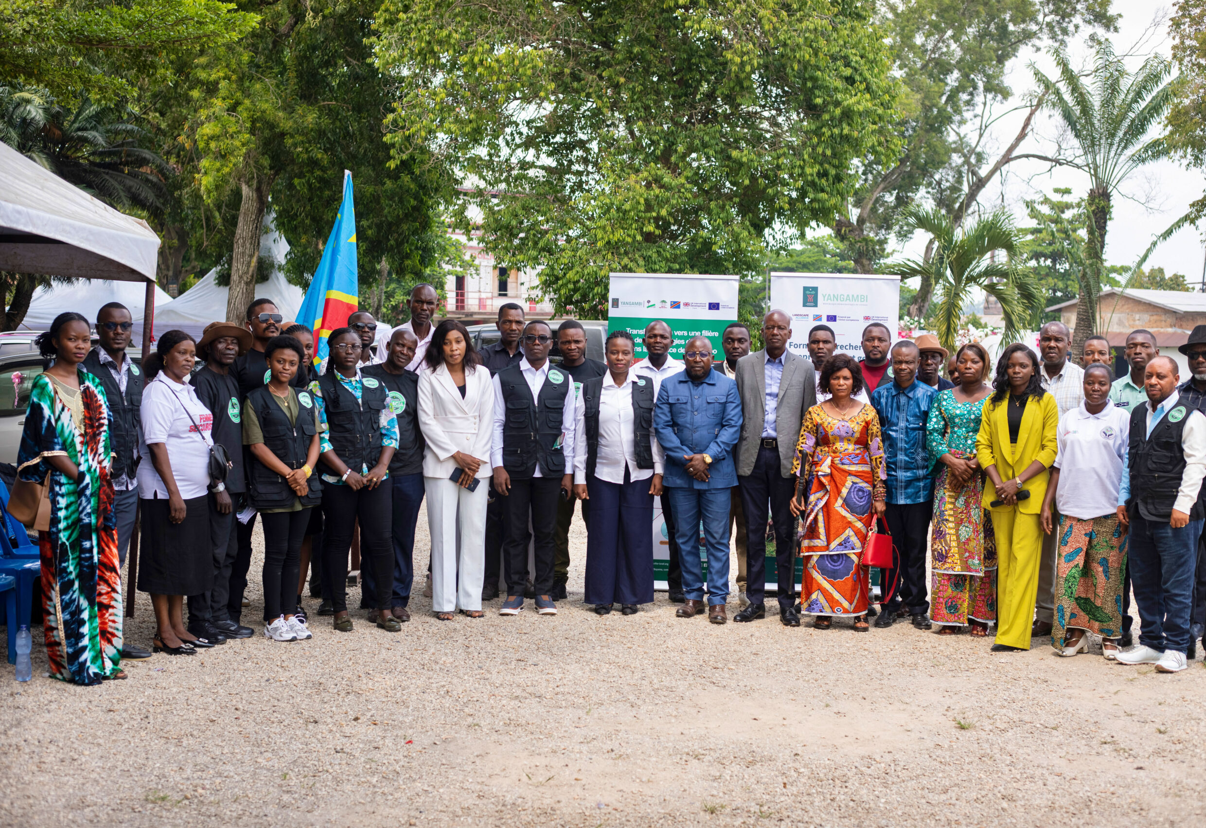 Participants, community leaders and project representatives pose for a group photo during the launch of the renewable charcoal awareness campaign in Kisangani, Democratic Republic of the Congo.