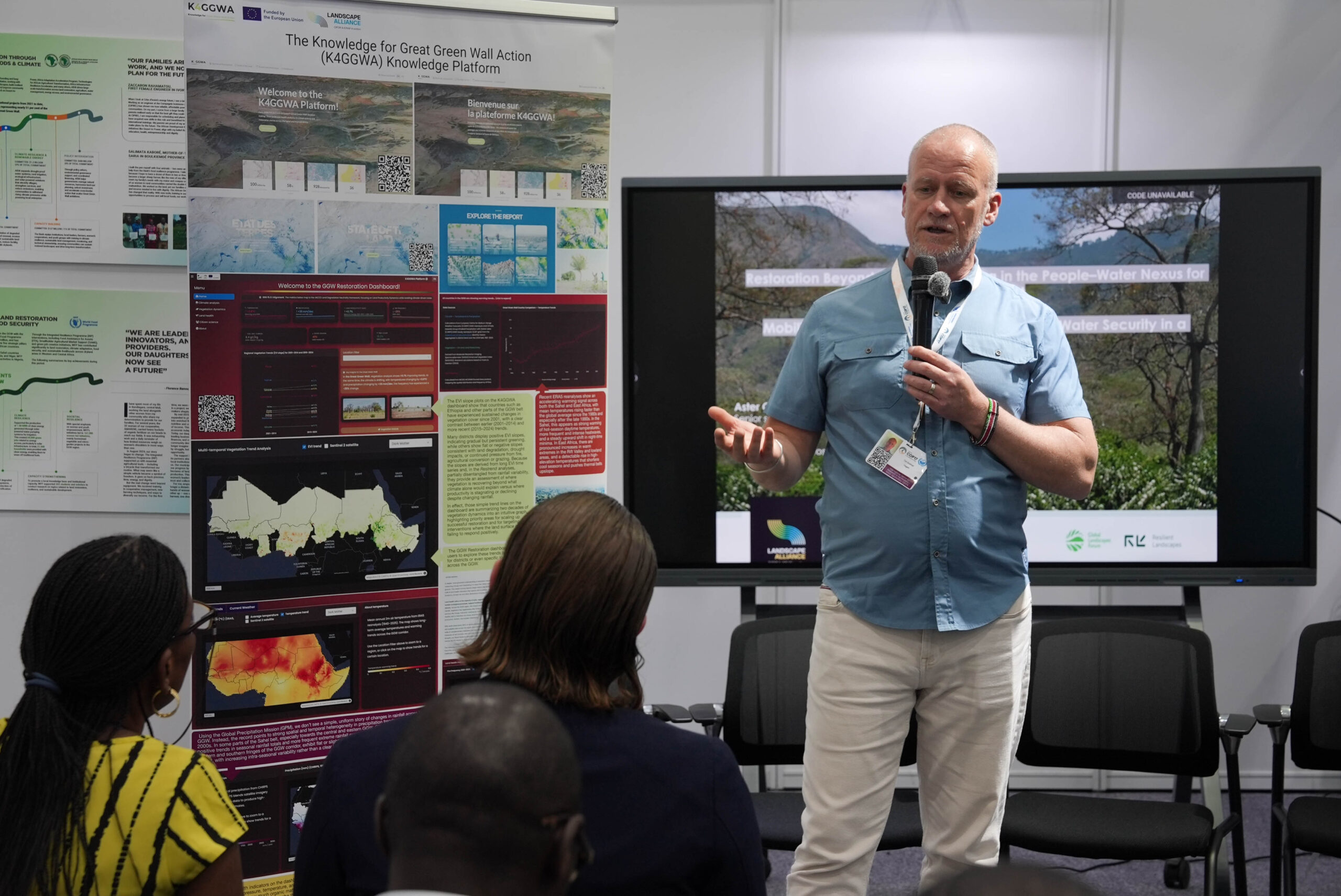 Tor-Gunnar Vågen presents the K4GGWA Knowledge Platform to participants at UNCCD COP17 in Ulaanbaatar, Mongolia. A display showing maps and spatial data is visible behind him.