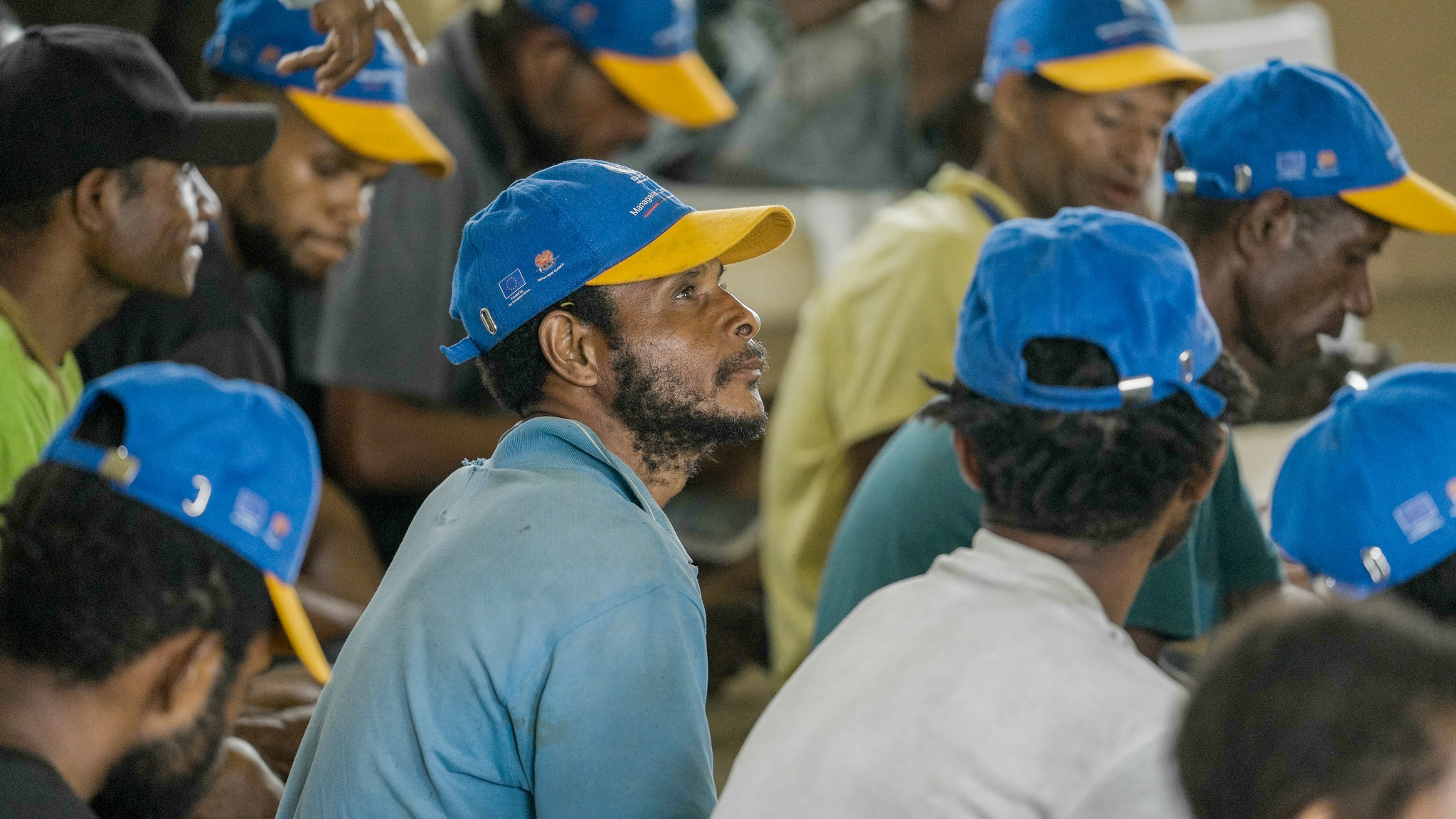 Participants sit together during a social media training workshop in the Managalas Conservation Area, Papua New Guinea.