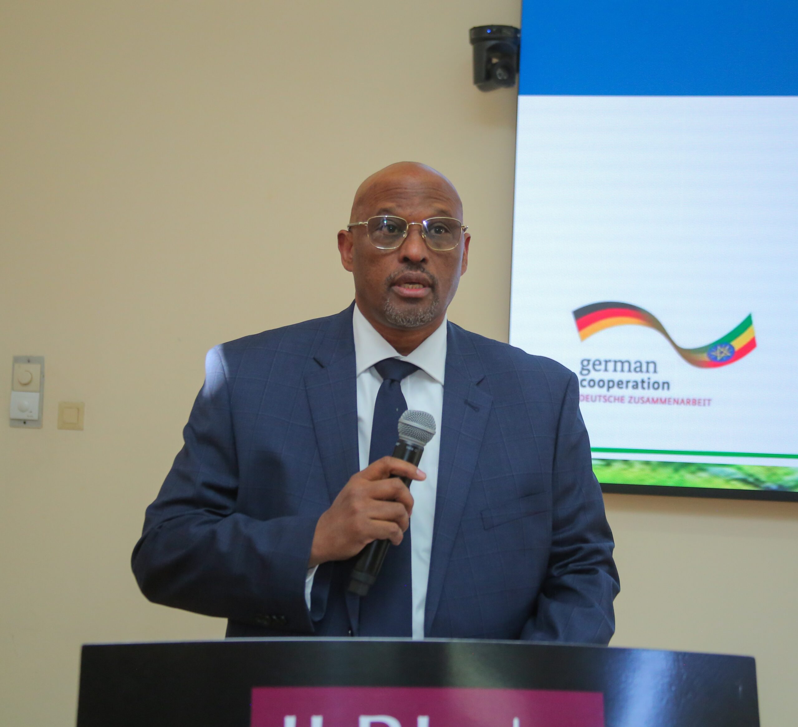 Prof. Eyasu Elias speaks at a podium during the national validation workshop for Ethiopia’s National Agroecology Strategy in Addis Ababa.