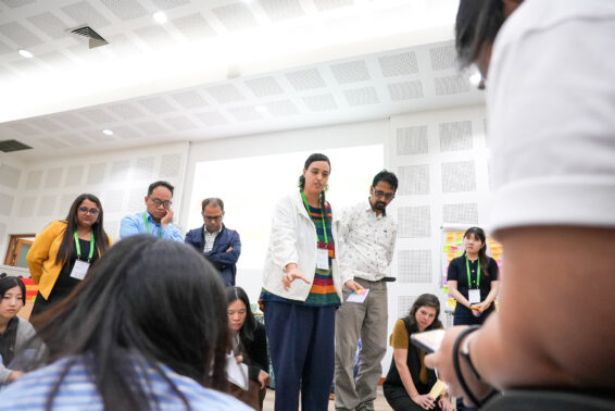 Participants discussing and working together during a restoration education workshop at CIFOR-ICRAF Bogor campus.