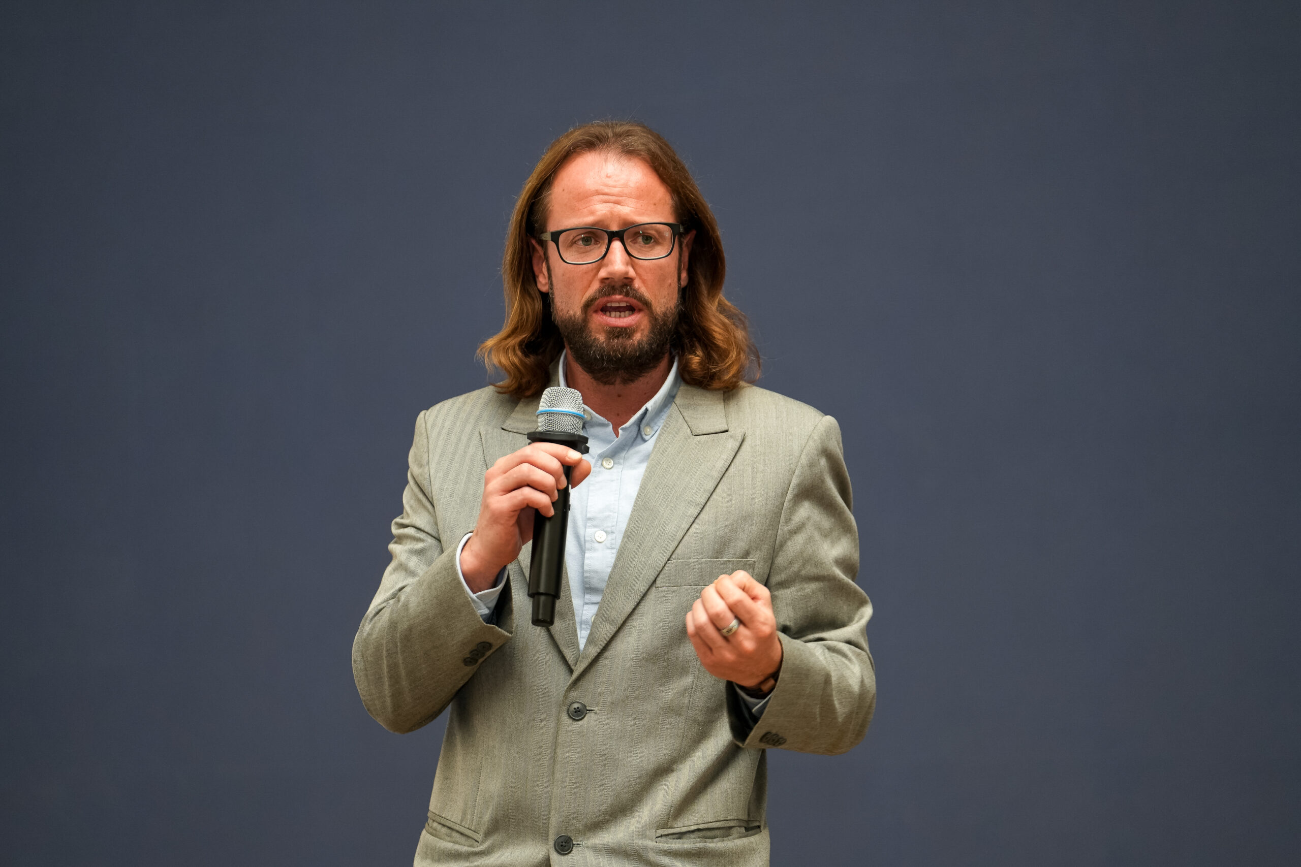 CIFOR-ICRAF scientist Matthias Geck speaking while holding a microphone at the launch event in Addis Ababa