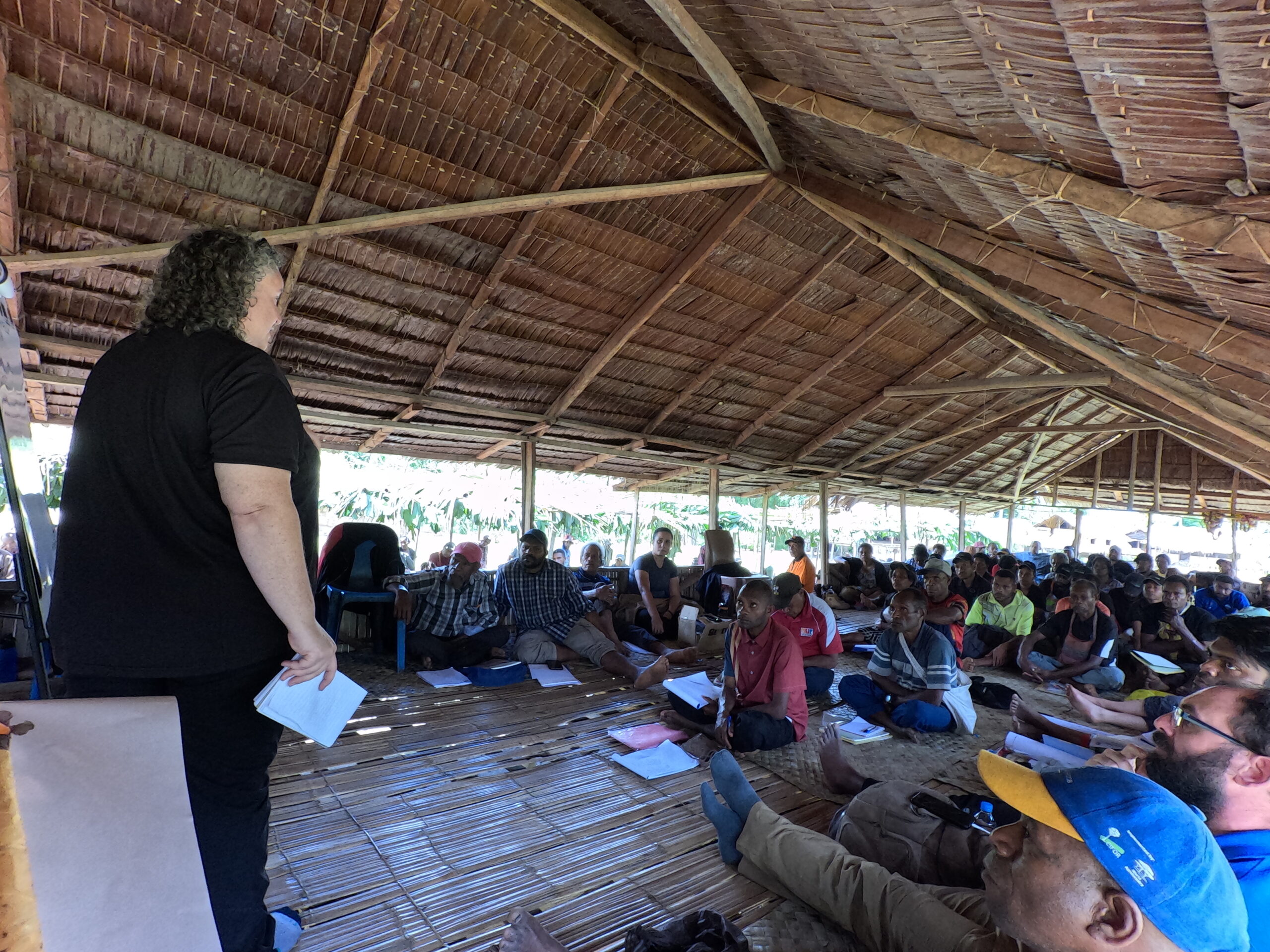 Forum participants listening to a presentation on sustainable livelihoods during the Combined Forum in Kawowogi Village on the Managalas Plateau in Papua New Guinea.