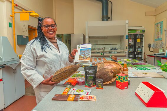 Alice Muchugi in a CIFOR-ICRAF laboratory handling tree seeds for conservation.