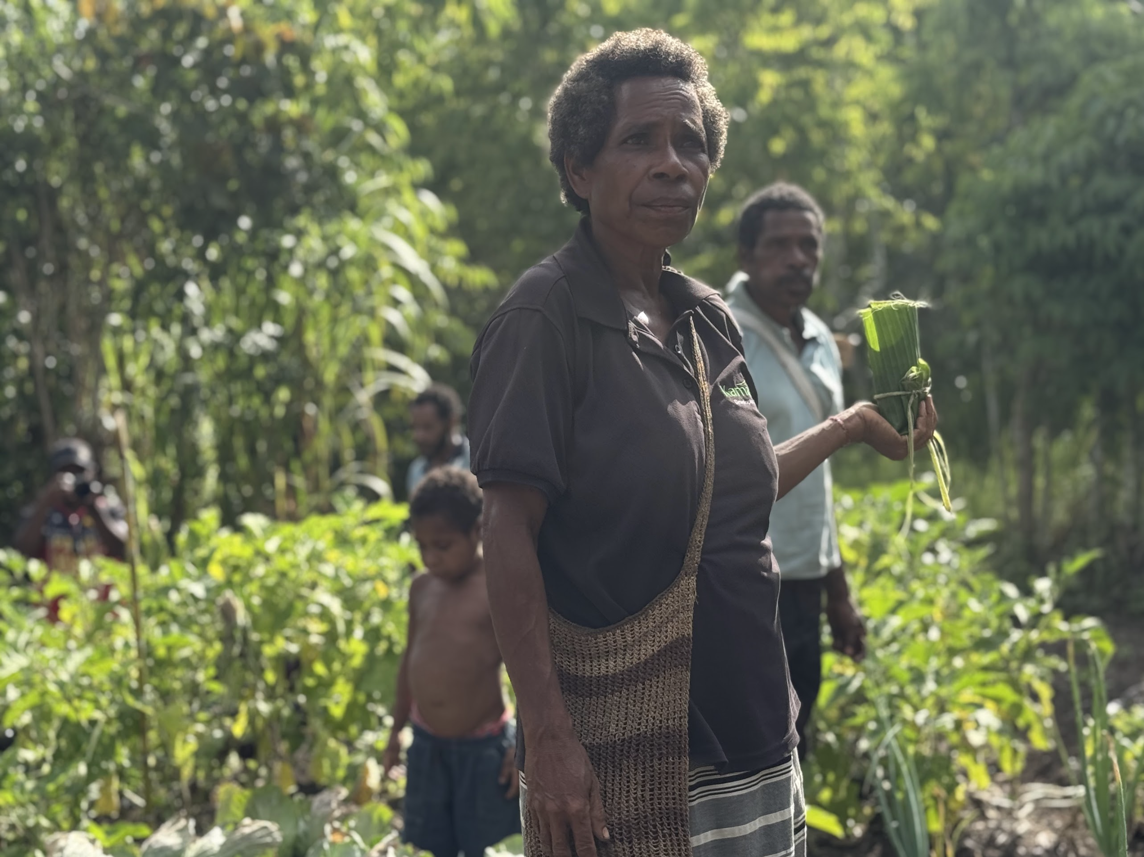 Local farmer Grace Juo standing in her vegetable garden in Kawowogi Village on the Managalas Plateau in Papua New Guinea.