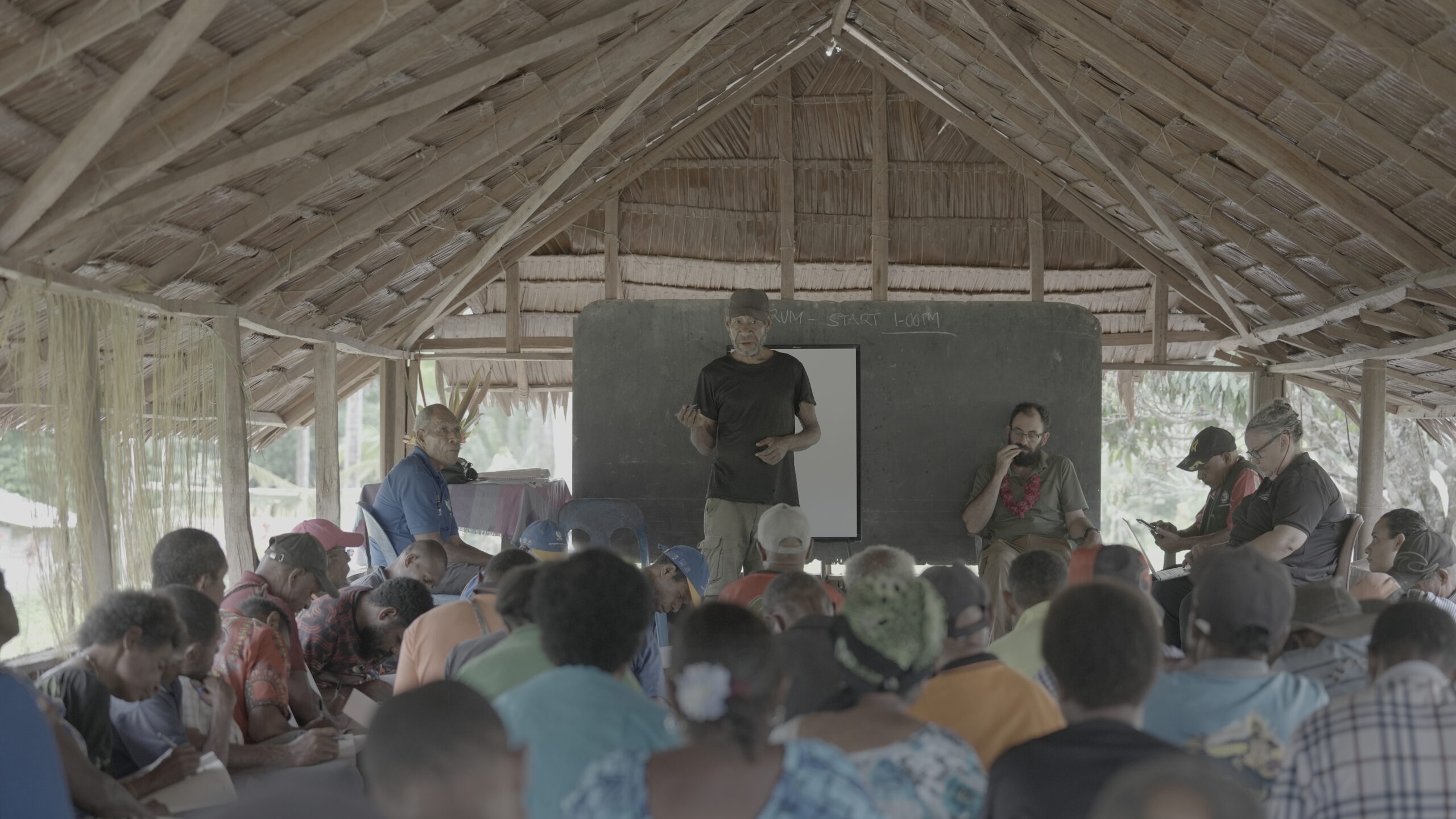 Community members attending the Combined Forum in Kawowogi Village on the Managalas Plateau, discussing conservation and sustainable livelihoods in Papua New Guinea.